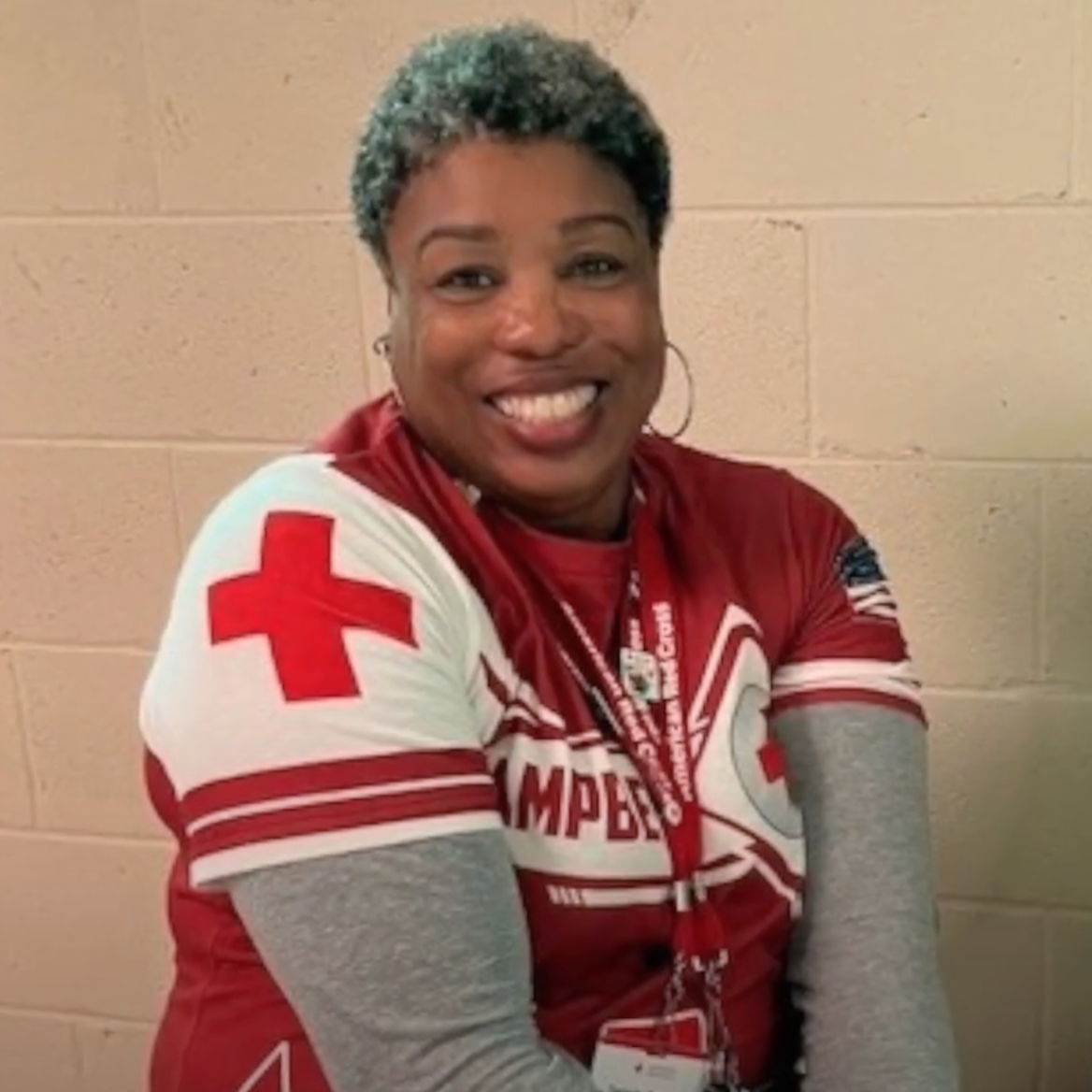 Photo of volunteer in Red Cross jersey